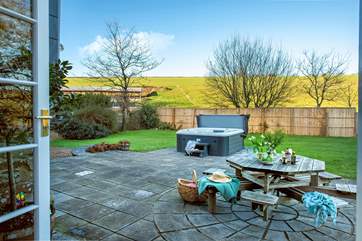 Patio doors lead out from the sitting-room to the garden