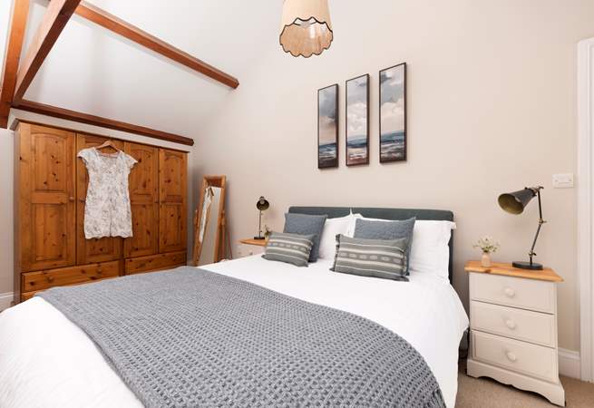 A comfy king-size bed awaits.