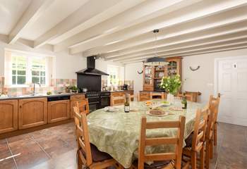 The spacious farmhouse-style kitchen/dining-room.