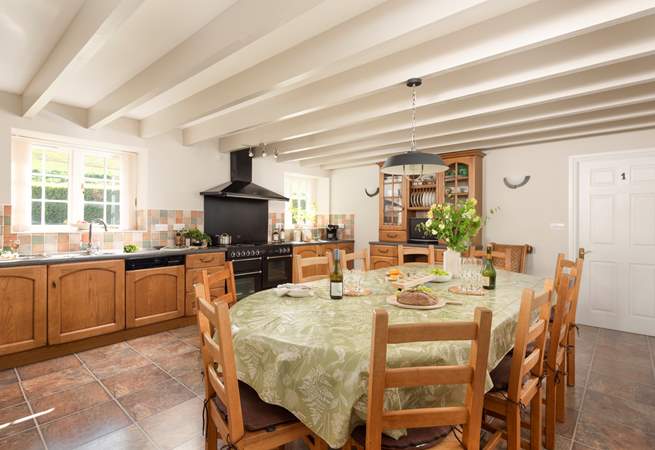 The spacious farmhouse-style kitchen/dining-room.