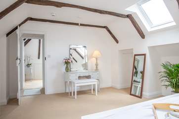 The dressing area with space to hang clothes.