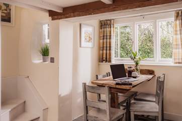 The dining-table doubles up as a cute office workspace.