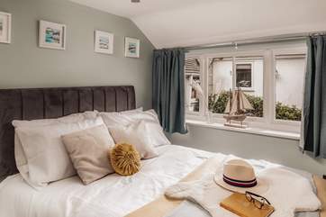Bedroom Two is a double and overlooks the shared courtyard.