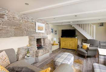 Light up the fire on cooler evenings. The sitting-room is made for relaxing. Cornish cottage stairs which can be steep in places,  take you up to the first floor. 