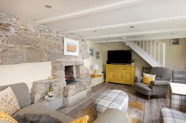 Light up the fire on cooler evenings. The sitting-room is made for relaxing. Cornish cottage stairs which can be steep in places, take you up to the first floor.