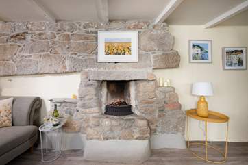 The lovely cosy open fire is perfect for chillier days.