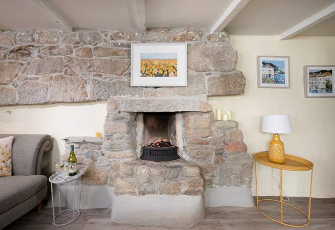 The lovely cosy open fire is perfect for chillier days. 