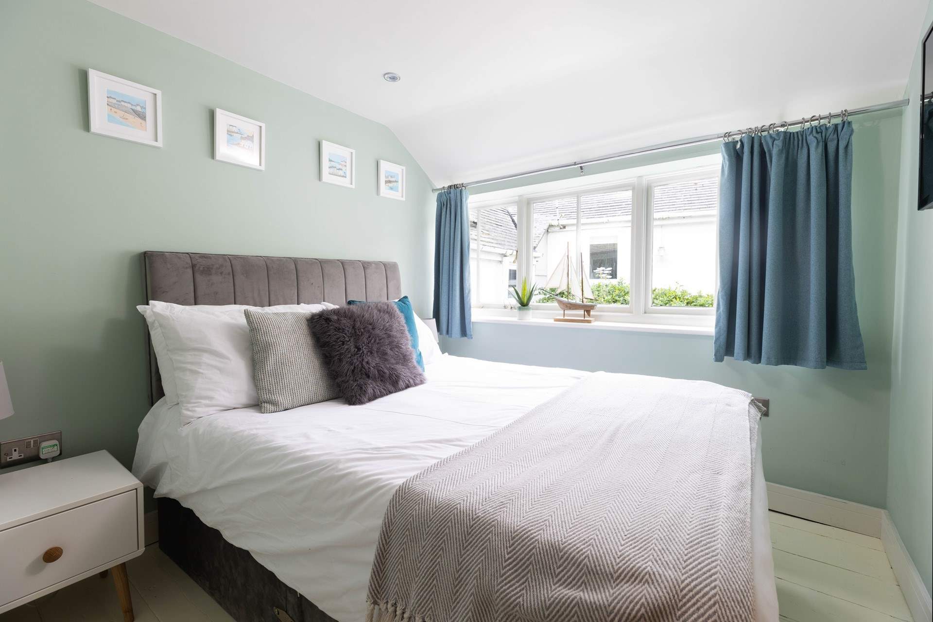 Bedroom 2 is a double and overlooks the shared courtyard.