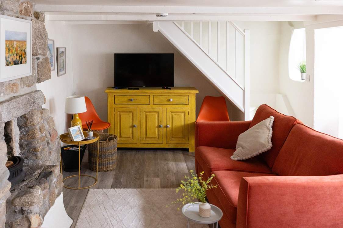 The sitting-room is made for relaxing, light the fire on cooler evenings for a cosy night in before heading up the steep cottage stairs.