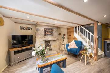 The cosy open plan living and dining area. Please note there is no longer a TV or DVD player at this property.