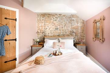 Just imagine climbing into this gorgeous bed after a full day of exploring the local area.