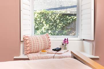 Watch the world go by from this cosy window seat in the bedroom.