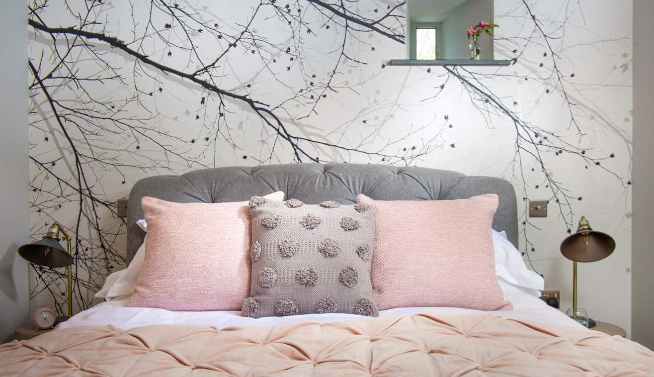 The bed is dressed to perfection.