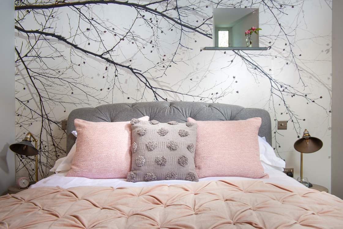 The bed is dressed to perfection.