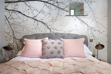 The bed is dressed to perfection.