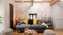 The lovely sofa invites you to snuggle up together.