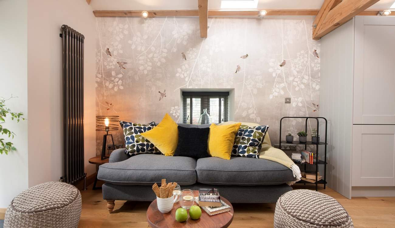 The lovely sofa invites you to snuggle up together.