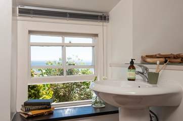 The super indulgent bathroom has a sumptuous free-standing bath for soaking in after a day of gallivanting around Cornwall.