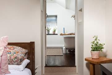 One step leads up to the bathroom from the bedroom.