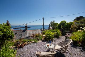 To the rear of the cottage, 15 steep steps lead up to the terrace, where you can enjoy the salty sea air and superb views across the bay.