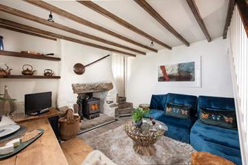Three steps lead down from the kitchen into the open plan sitting/dining area.
