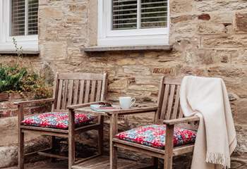 This cute little seating area is the perfect spot for a morning coffee. 