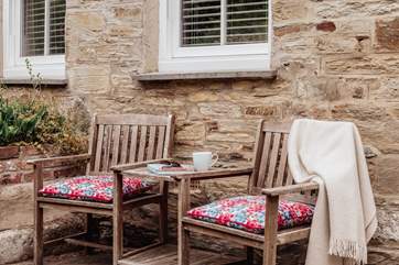 This cute little seating area is the perfect spot for a morning coffee.