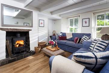 The sitting-room is a wonderfully cosy hideaway with two comfortable sofas perfect for sinking into at the end of the day.