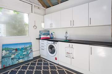 Outside, you will find the Surf and Fur Shack, with useful utility area. To the rear of the cottage is an outside shower area where you can rinse off sandy paws and salty surfboards at the end of the day.