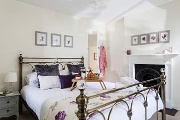 The main bedroom is light and airy and overlooks the front of the cottage.