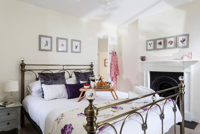 The main bedroom is light and airy and overlooks the front of the cottage.