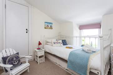 The colourful third bedroom has a single bed and a trundle bed (Smugglers accommodates five with flexibility of beds), perfect for children.