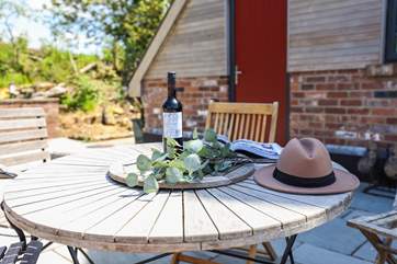 Sit back and listen to birdsong on the patio at the rear of the house.