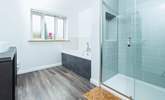 Bathroom 1 is beautifully created with both a walk-in shower and bath. - Thumbnail Image