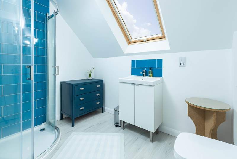 The en suite shower-room to bedroom 1 has a lovely corner shower and fills with natural light from the Velux window.