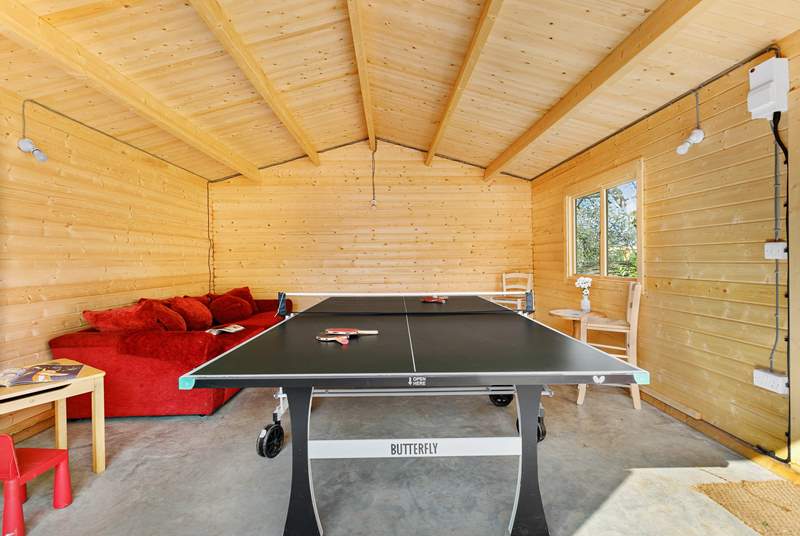 The games-room with full-size table-tennis table will keep the family entertained.