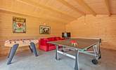 The games-room with full-size table-tennis table will keep the family entertained. - Thumbnail Image