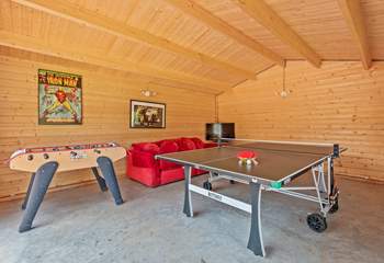 The games-room with full-size table-tennis table will keep the family entertained.