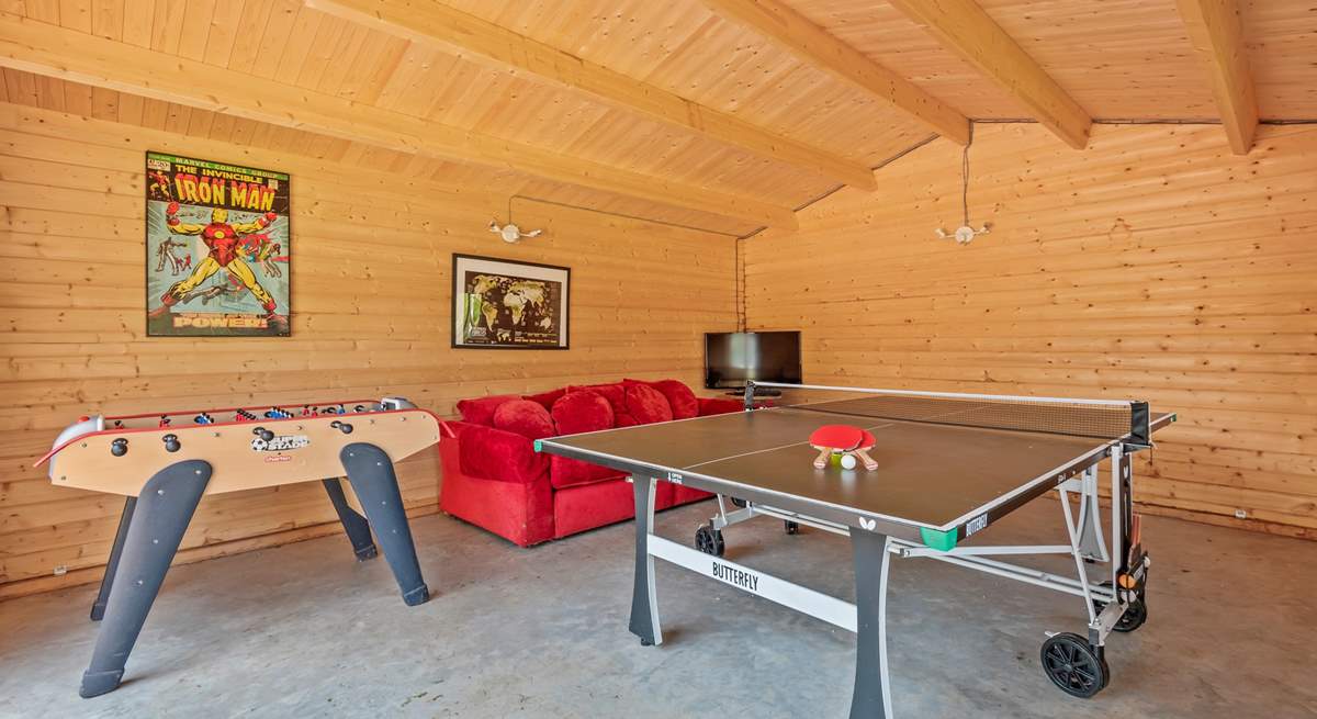 The games-room with full-size table-tennis table will keep the family entertained.