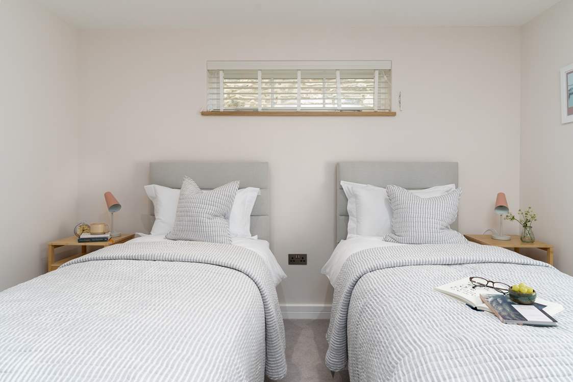 The second bedroom has lovely calming tones.