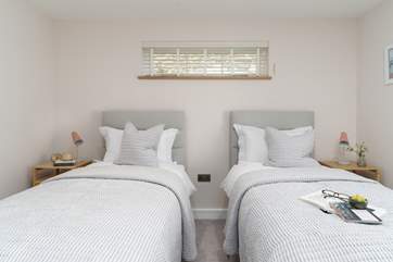 The second bedroom has lovely calming tones.