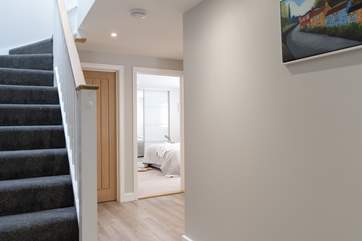 Rosemary Cottage offers reverse-level accommodation with the staircase leading up to the open plan living area.