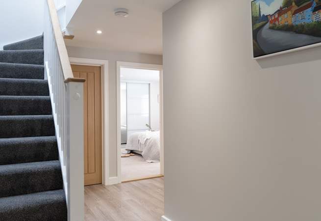 Rosemary Cottage offers reverse-level accommodation with the staircase leading up to the open plan living area.