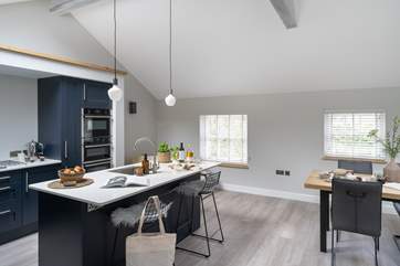 The light and spacious kitchen makes for a delightful place to cook up a feast.