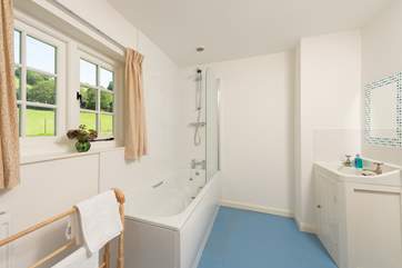 The recently refurbished bathroom looks out over rolling countryside.