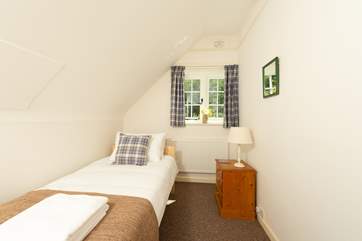 This sweet single bedroom looks out over the garden.