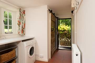 Entering through the side door, this is a great space for dogs and wellies! Behind the gorgeous wooden door is the handy WC.