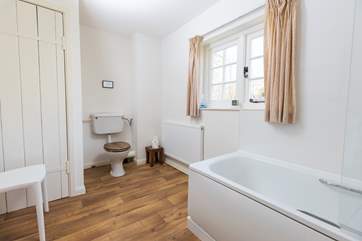 The recently refurbished bathroom looks out over rolling countryside.