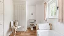 The recently refurbished bathroom looks out over rolling countryside.