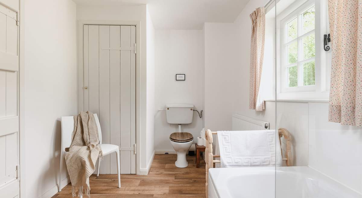 The recently refurbished bathroom looks out over rolling countryside.